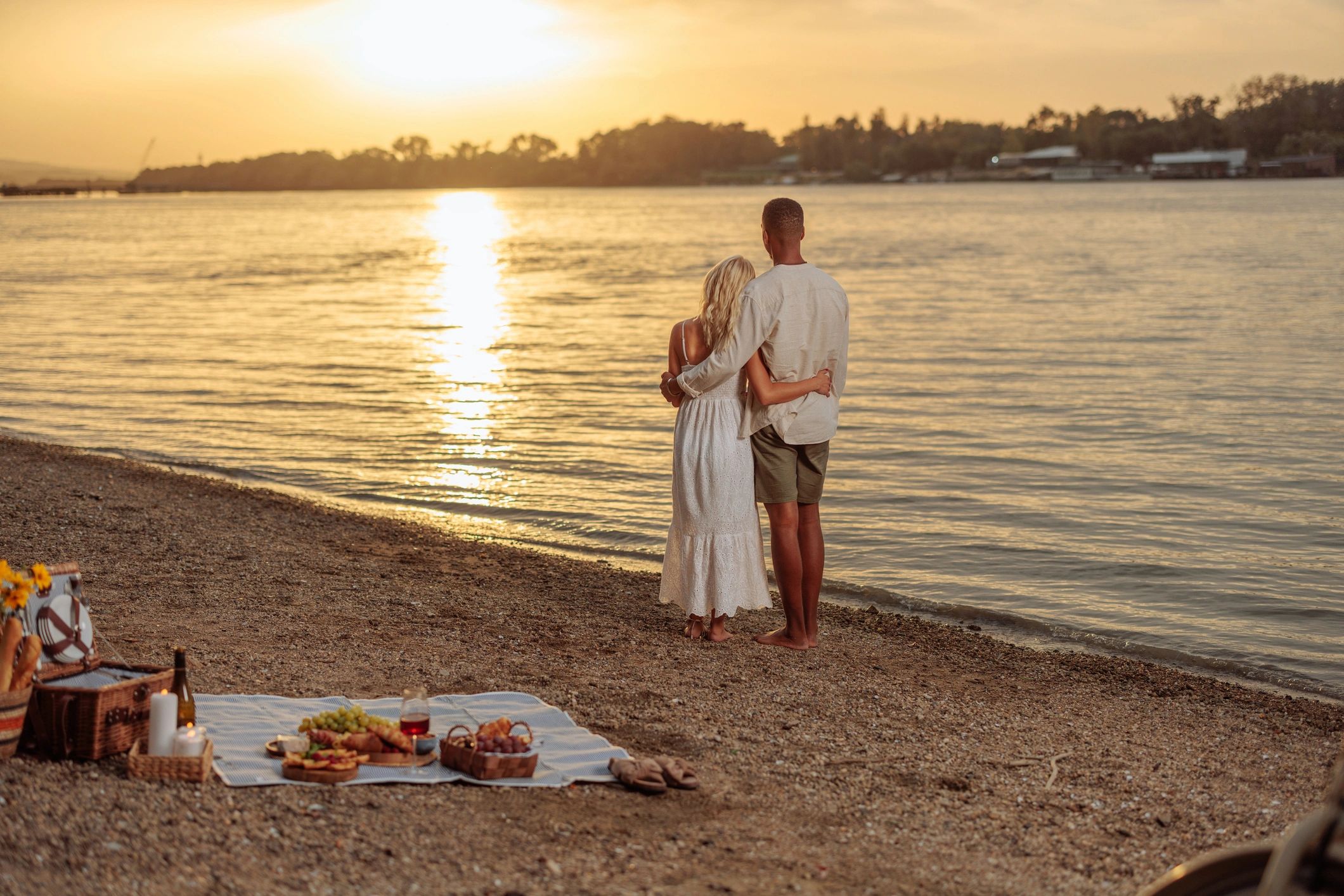 Couple enjoying a romantic sunset during a getaway