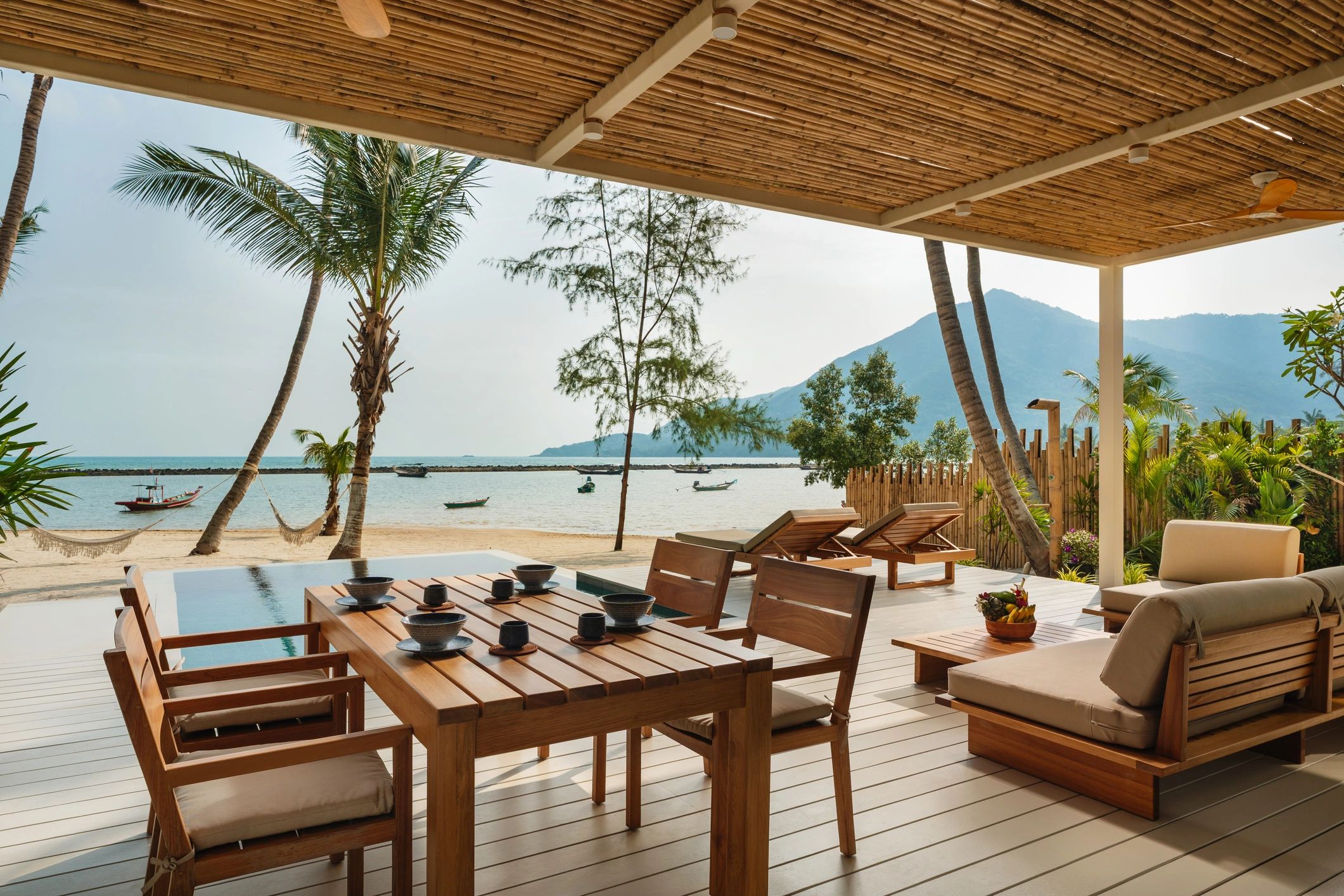 Beachfront luxury villa dining area at a tropical resort